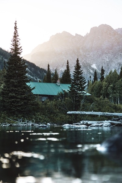 a lake photo with a green house