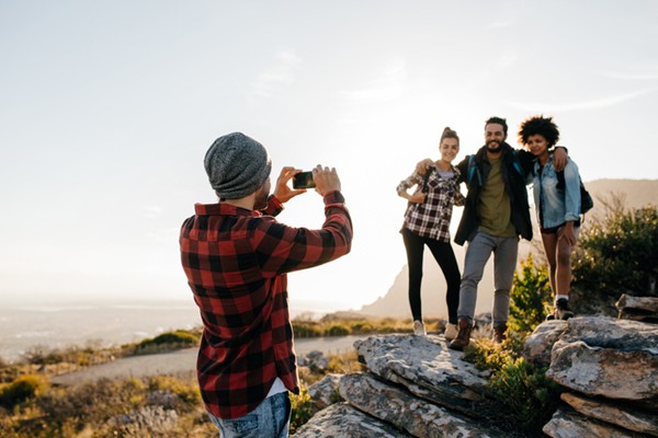 a man photoshooting a group photo